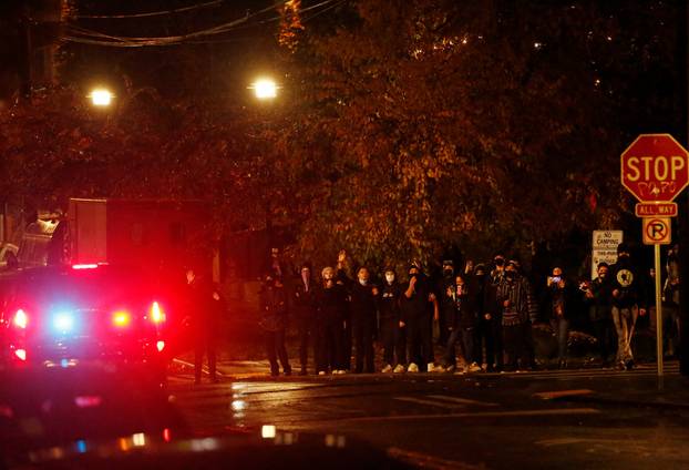 Police officers respond to a protest march that took place on Election Day in Seattle