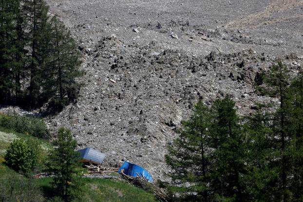 A view shows debris and dust from a crumbling glacier that partially collapsed and tumbled onto Blatten