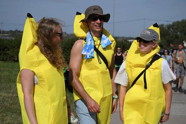 Revellers attend Glastonbury Festival at Worthy Farm in Pilton