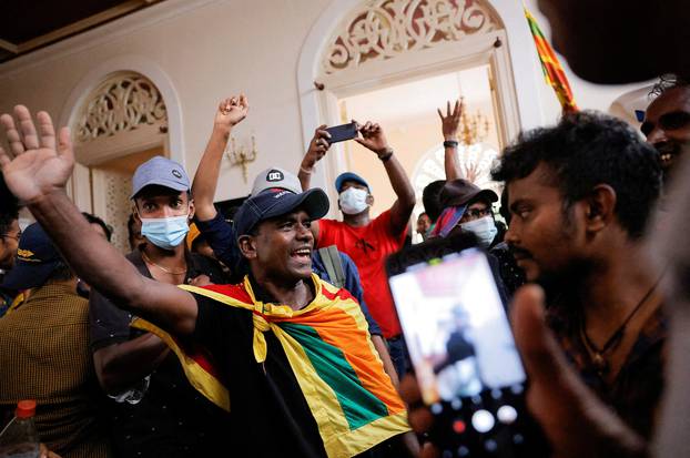 Demonstrators protest inside the President's House, after President Gotabaya Rajapaksa fled, in Colombo