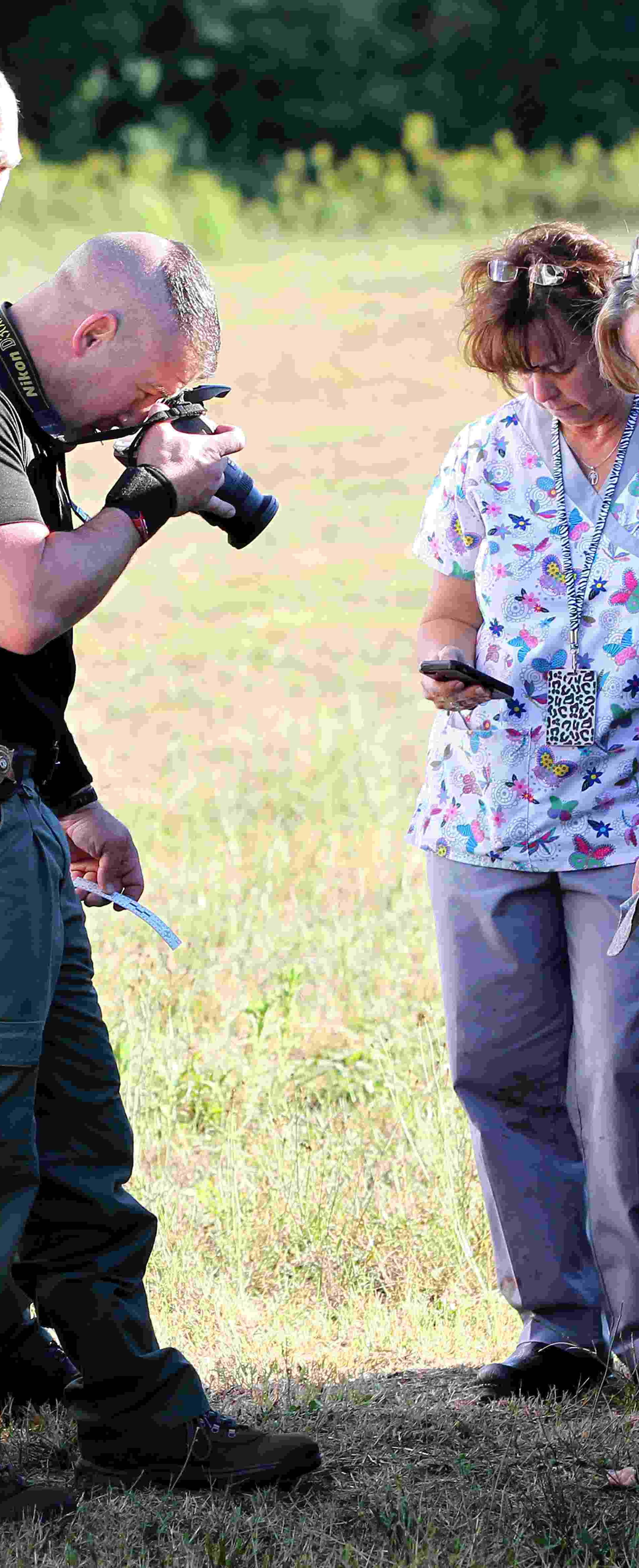 Anderson County sheriff's deputies gather evidence outside of Townville Elementary School in Townville