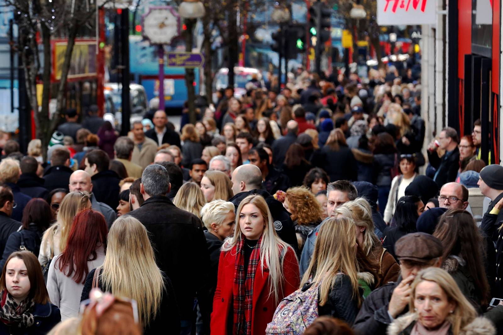FILE PHOTO: Shoppers throng Oxford street during the final weekend of shopping before Christmas in London