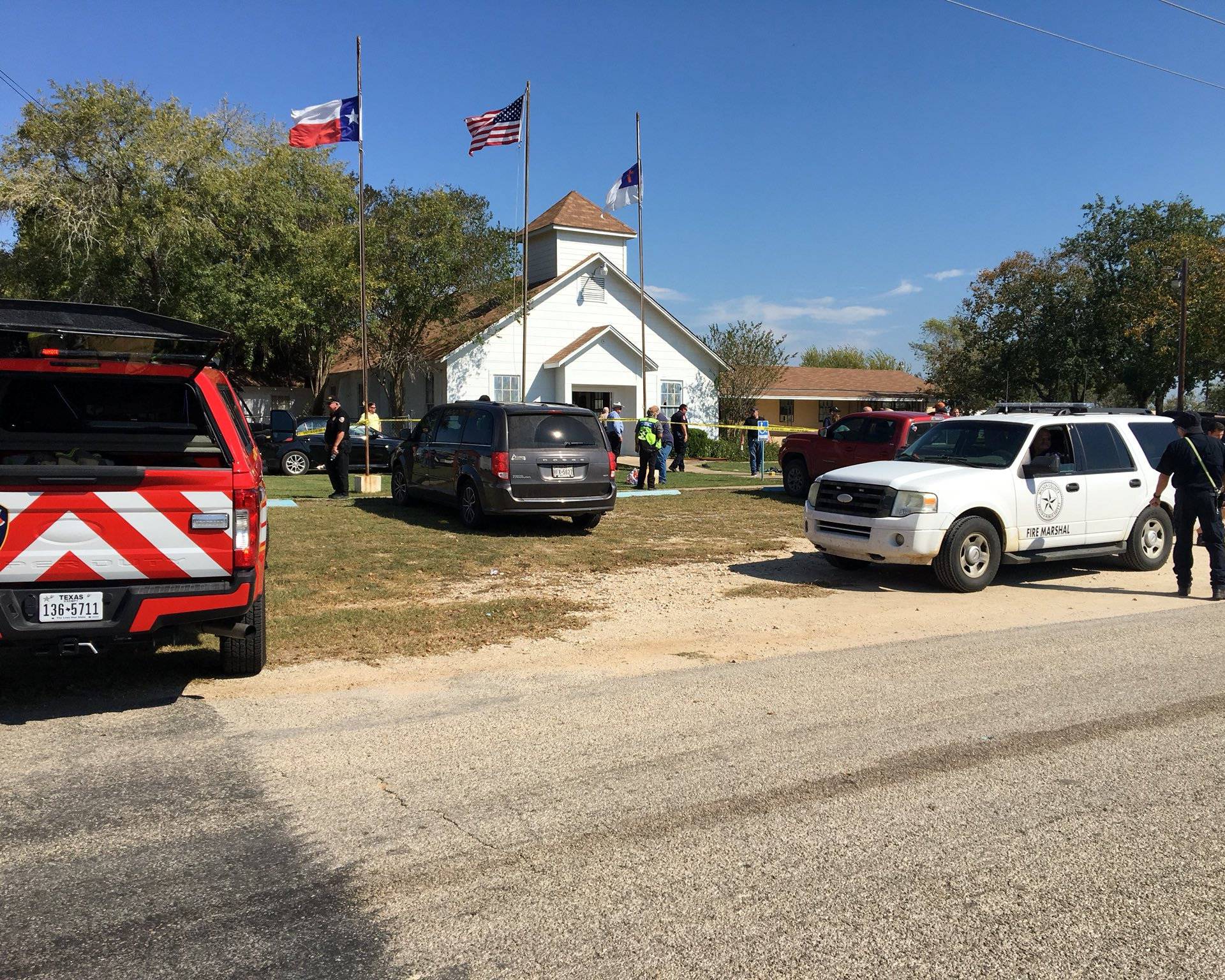 The area around a site of a mass shooting is taped out in Sutherland Springs