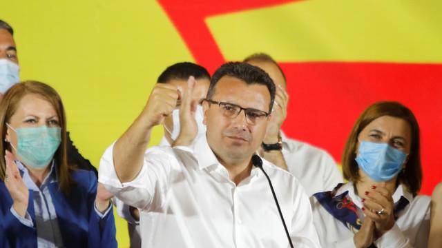 Macedonian Former Prime Minister and leader of the ruling SDSM party Zoran Zaev celebrates his victory in a parliamentary election in Skopje