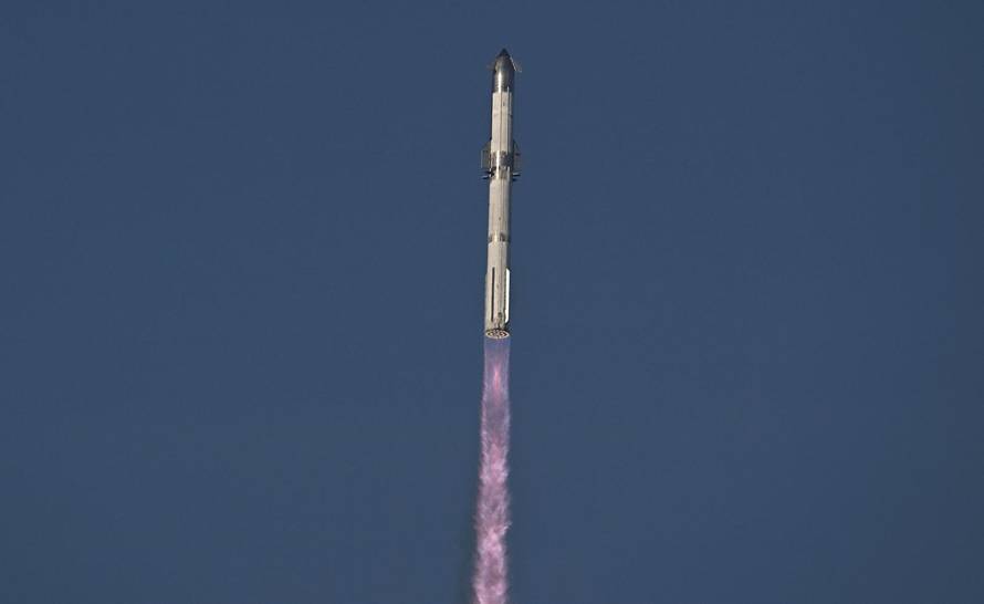 A SpaceX Super Heavy booster carrying the Starship spacecraft lifts off on its 10th test flight