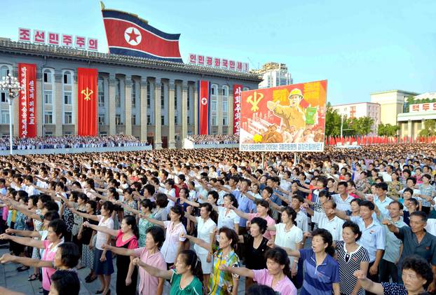 People participate in a Pyongyang city mass rally held at Kim Il Sung Square to fully support the statement of the DPRK government