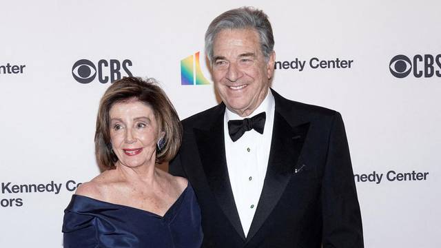 FILE PHOTO: Speaker of the House Nancy Pelosi (D-CA) and her husband Paul Pelosi arrive for the 42nd Annual Kennedy Awards Honors in Washington