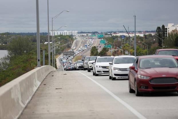 Heavy traffic begins to back up on Interstate 275 South as residents evacuate St. Petersburg, Florida