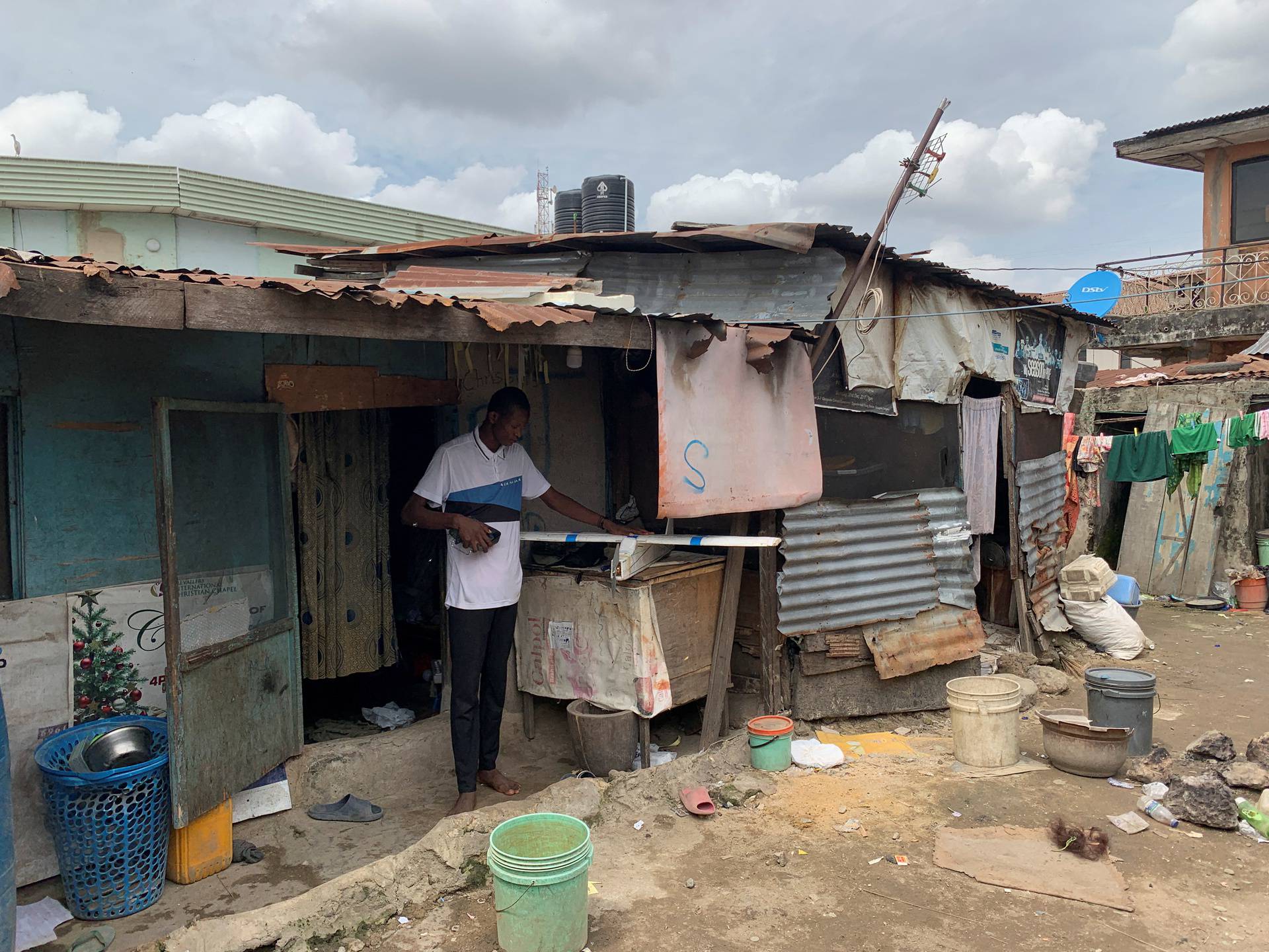 Bolaji Fatai builds a model aeroplane from discarded waste in Lagos