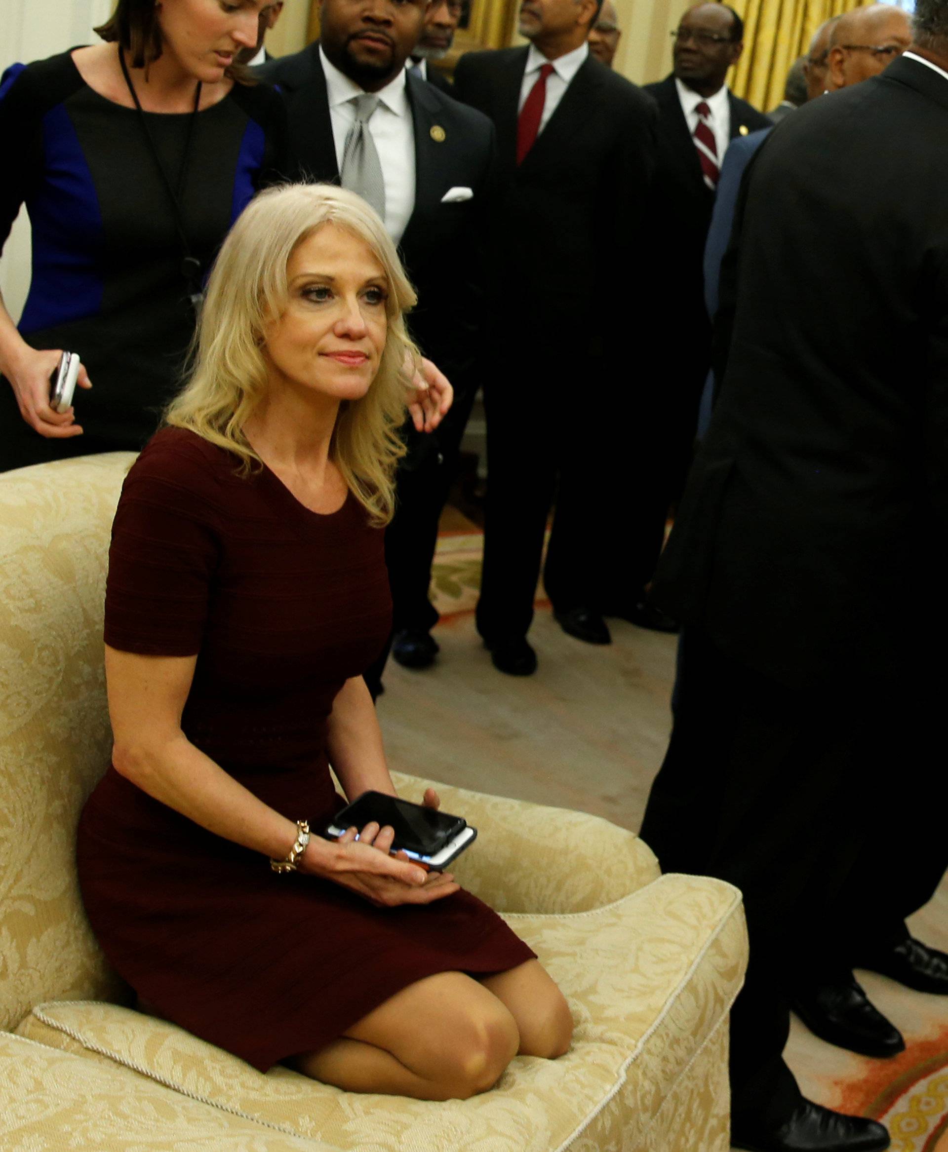 Senior advisor Kellyanne Conway sits on a couch as U.S. President Donald Trump welcomes the leaders of dozens of historically black colleges and universities (HBCU) in the Oval Office at the White House in Washington