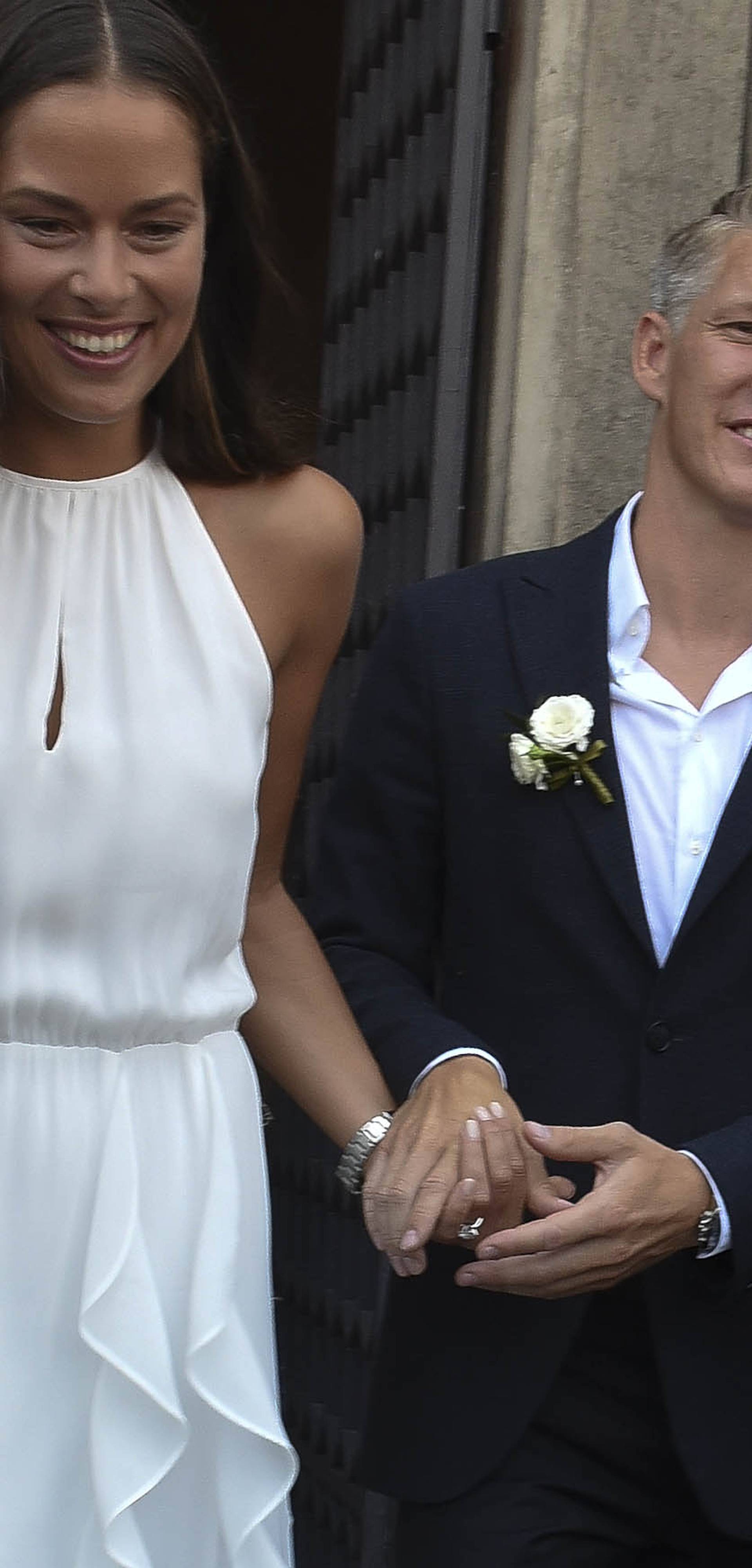 Manchester Utd and Germany National team player Bastian Schweinsteiger ties the know with his fiancee' Ana Ivanovic at Venice City Hall. NO ITALY NO GERMANY