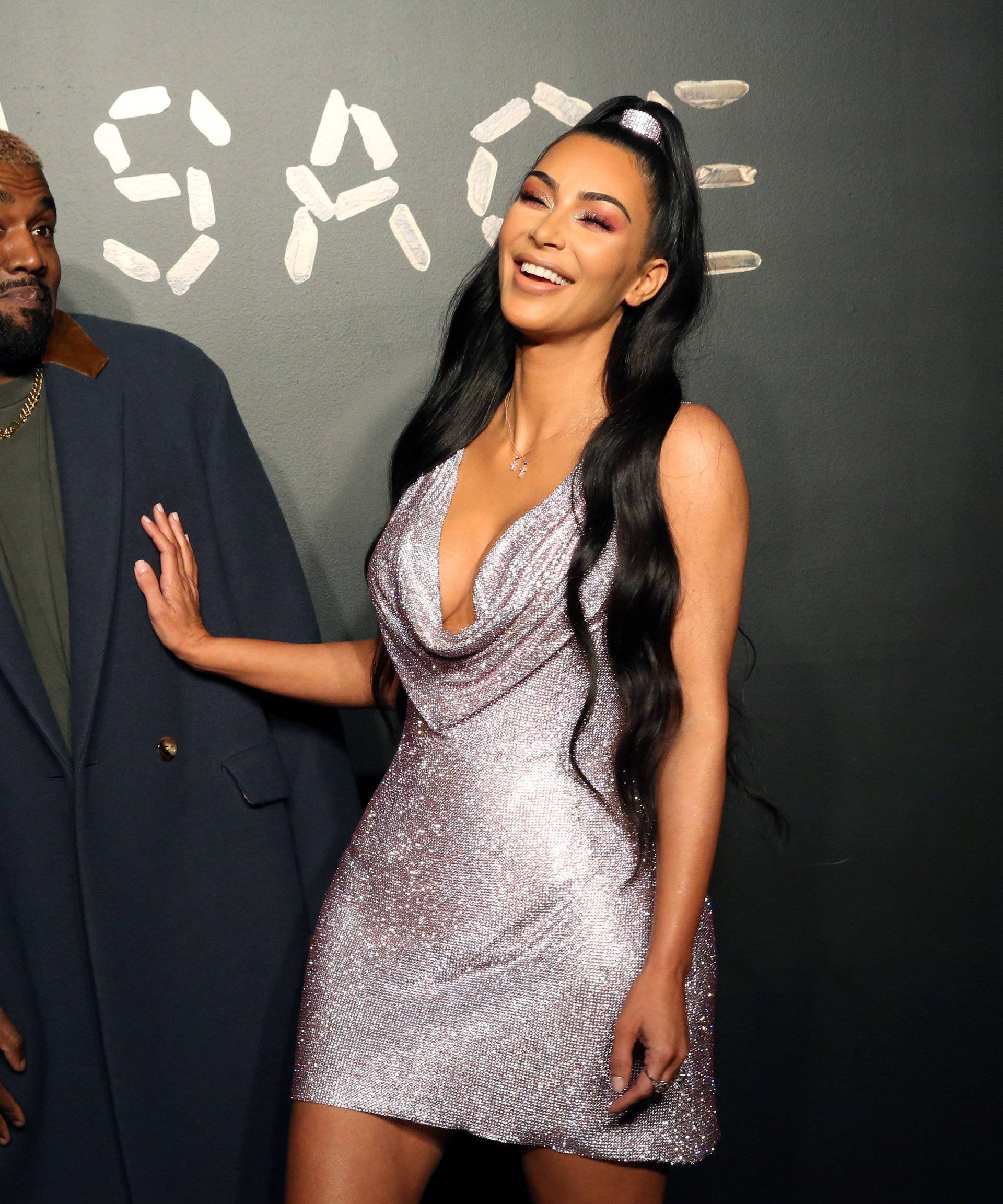 Kanye West and Kim Kardashian pose for a photo before attending the Versace presentation in New York