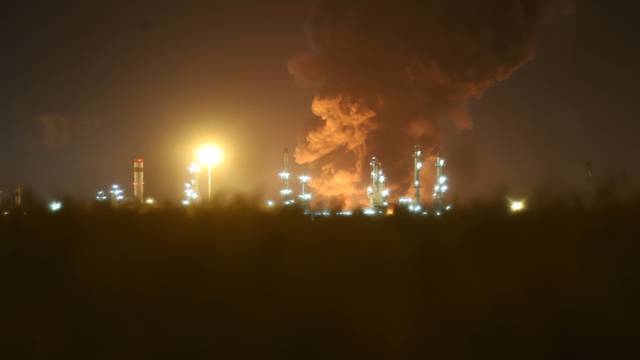 Smoke rises at an oil refinery in Tehran