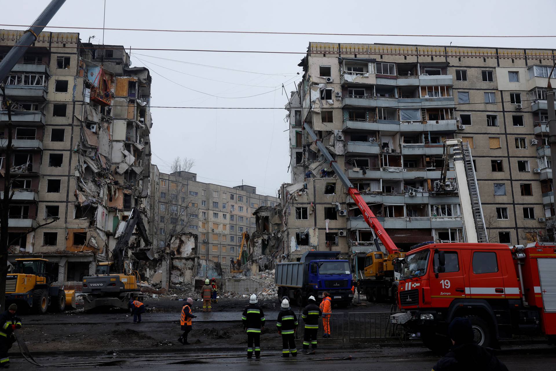 Aftermath of Dnipro apartment block destruction following missile strike