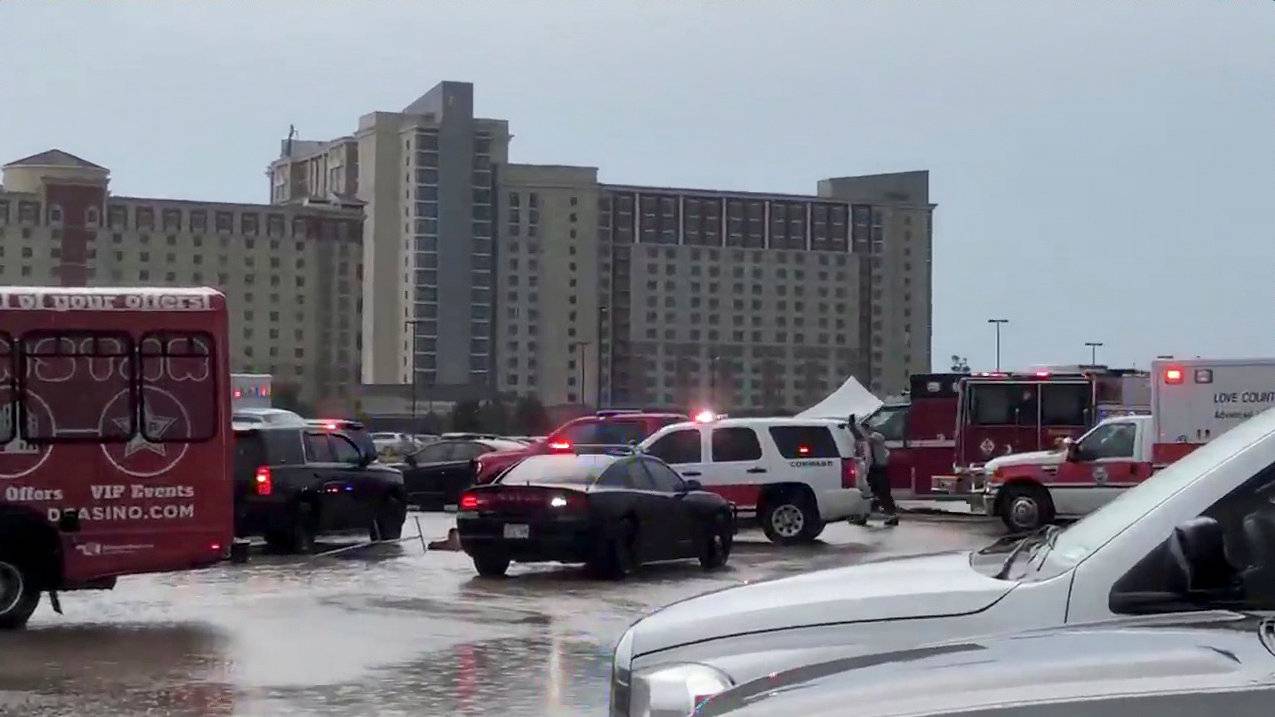 Emergency vehicles and crew are seen in Thackerville, Oklahoma