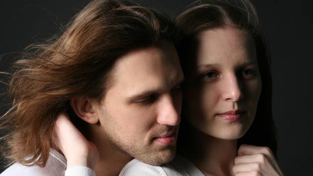 Young Man and woman isolated on black background