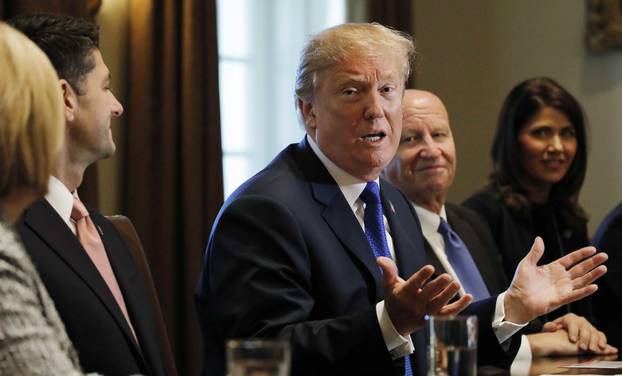 U.S. President Donald Trump talks about a newly unveiled Republican tax plan with House Republican leaders in the Cabinet Room of the White House in Washington