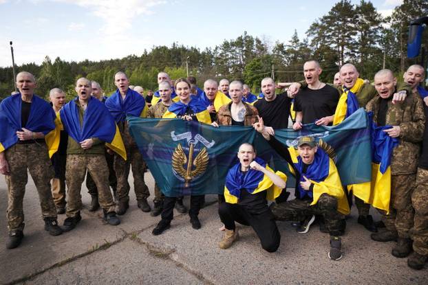 Ukrainian POWs are seen after a swap at an unknown location in Ukraine