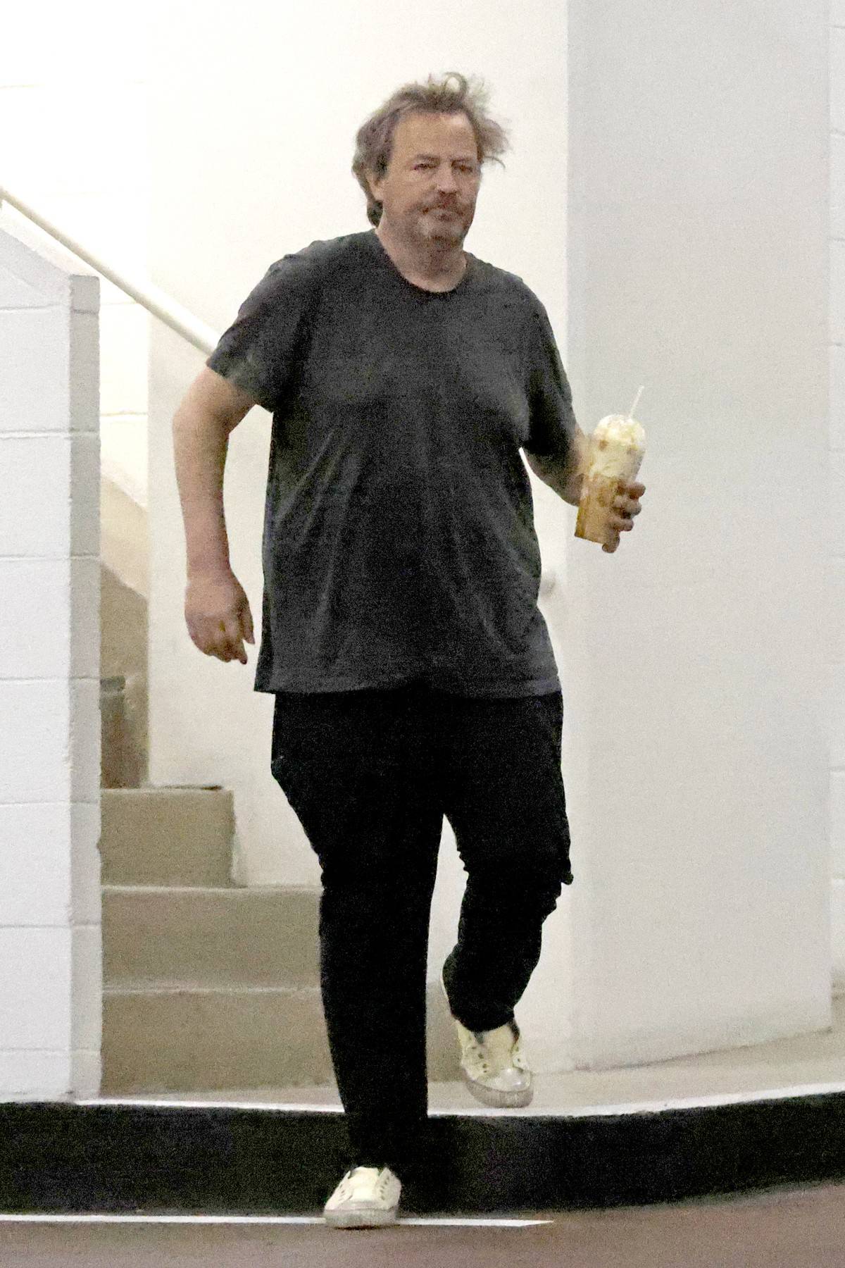 Matthew Perry is seen in a rare public outing as he runs errands with a female companion in Beverly Hills.