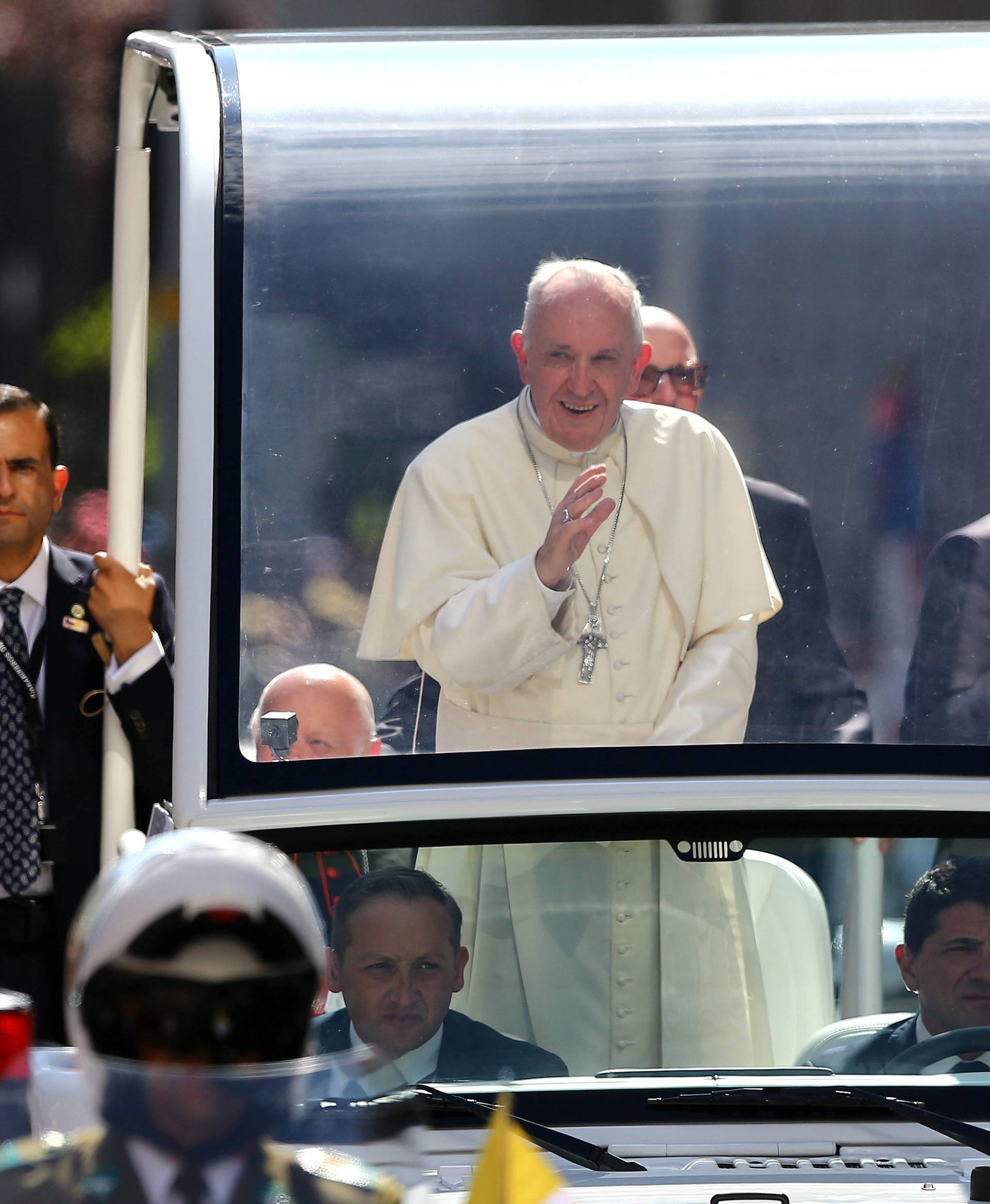 Pope Francis waves to the crowd while arriving to the Cathedral of Santiago, in Santiago,