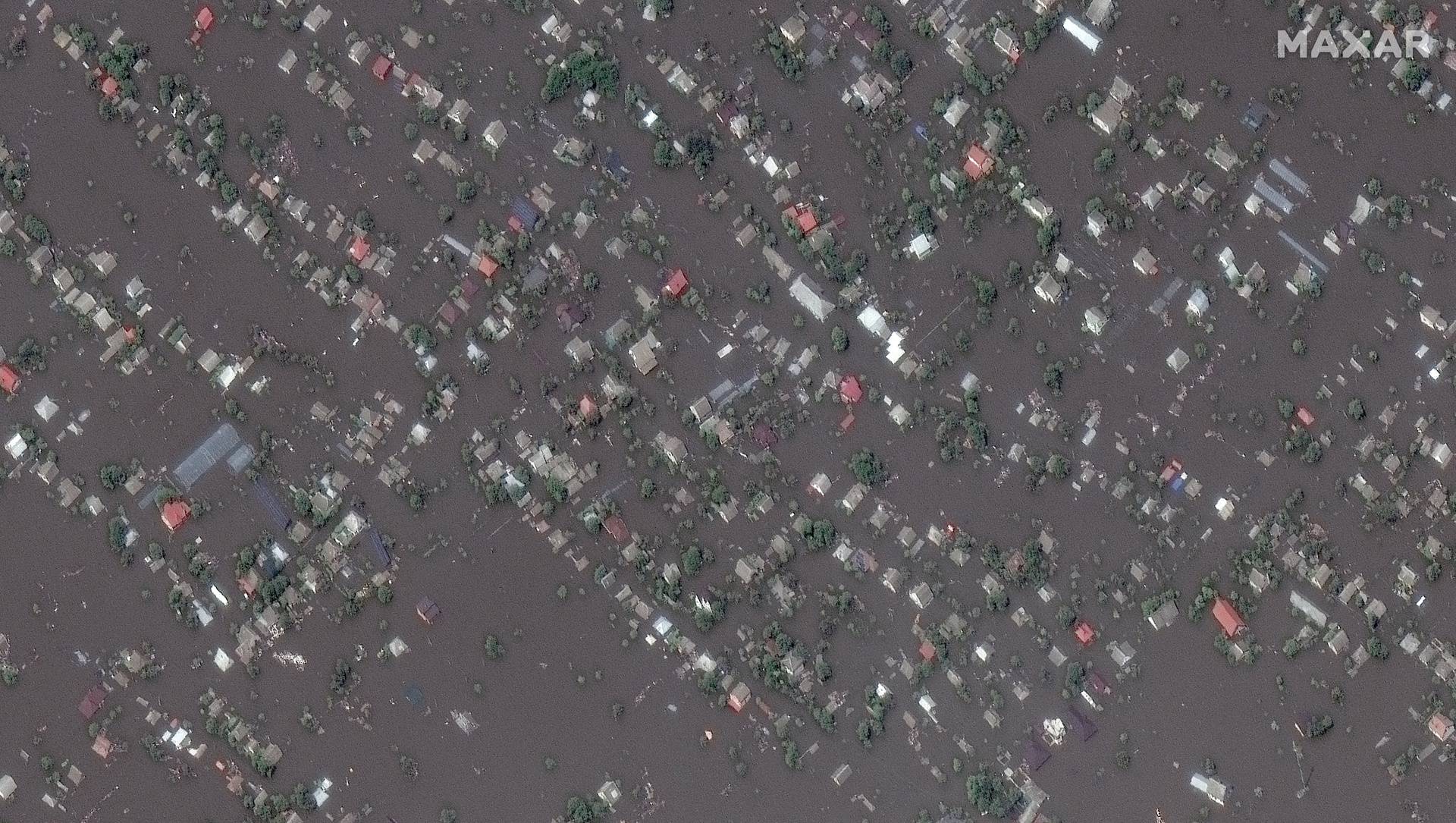 A satellite image shows the flooded town of Oleshky
