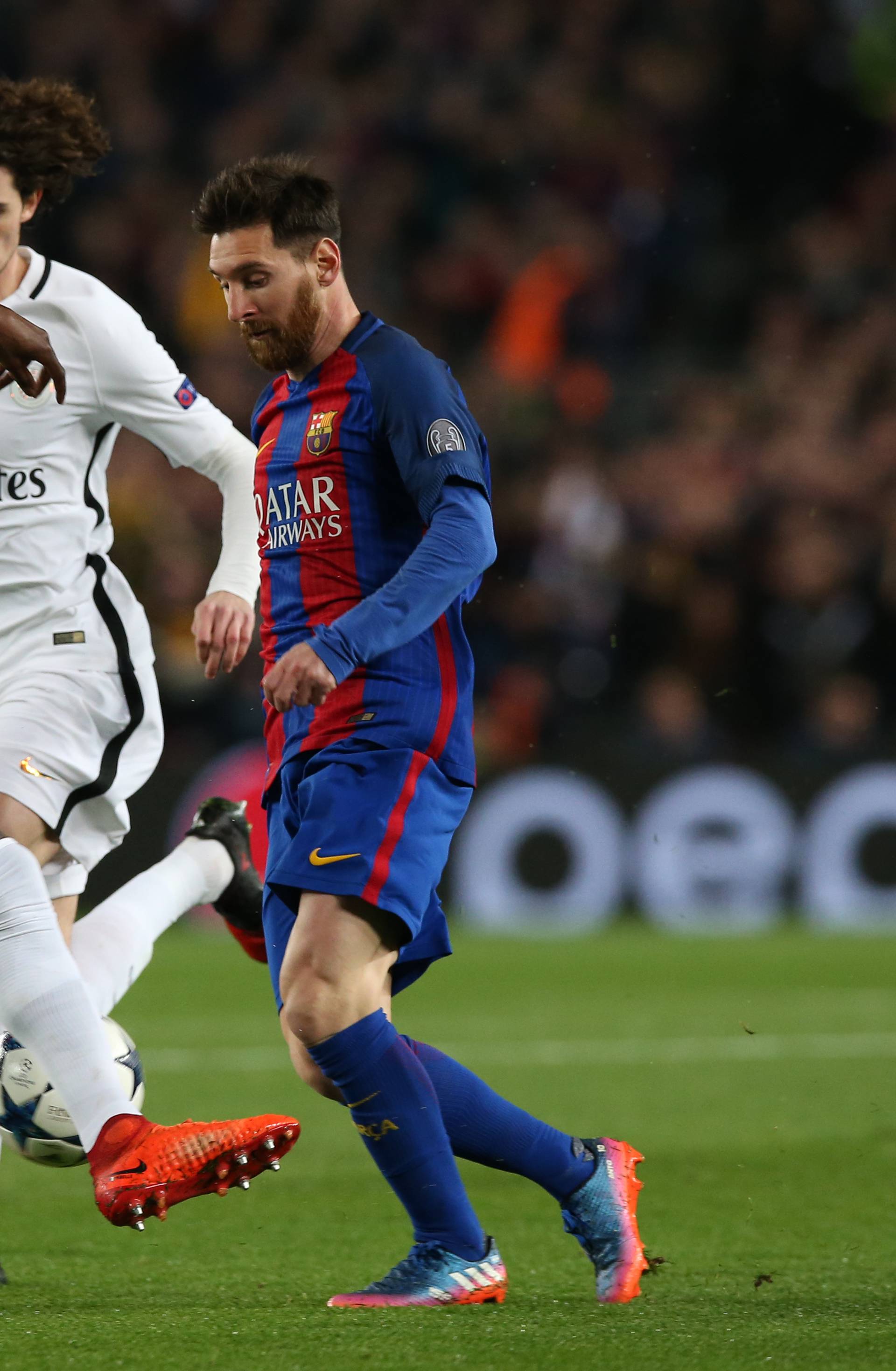 Paris Saint-Germain's Blaise Matuidi in action with Barcelona's Lionel Messi