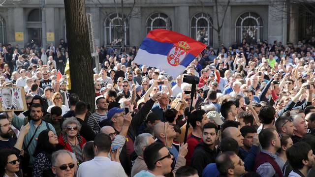 Demonstrators attend a protest against Serbian President Vucic and his government in front of the presidential building in Belgrade