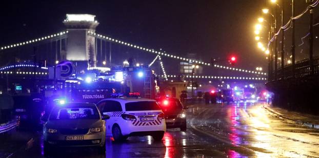 Police and fire brigade vehicles are seen on the Danube bank after tourist boat capsized on the river&Acirc;&nbsp;in Budapest