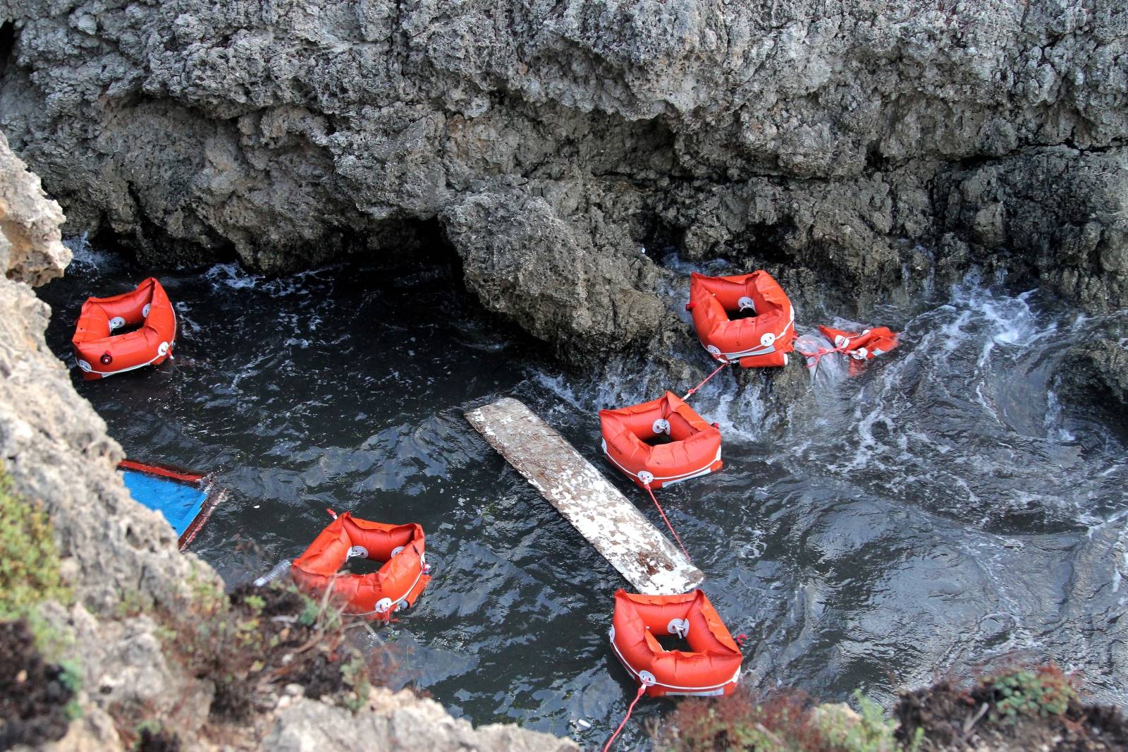 Flotation devices are seen in the area where a migrant boat capsized off the Italian coast, on the island of Lampedusa