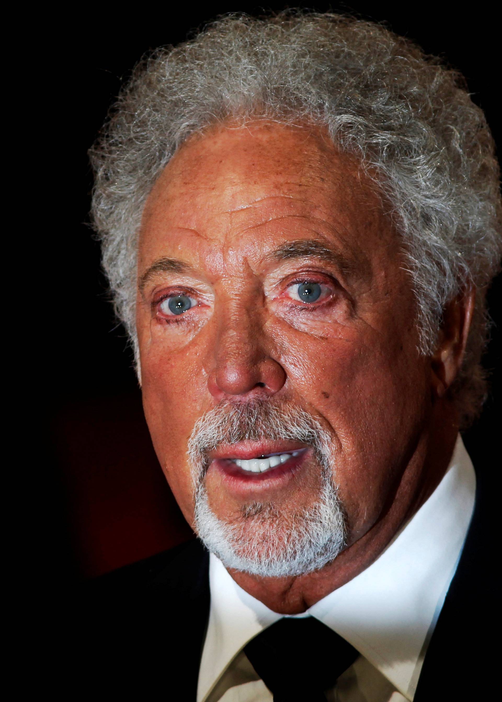 FILE PHOTO: Singer Tom Jones arrives for the British Academy of Film and Arts (BAFTA) awards ceremony at the Royal Opera House in London