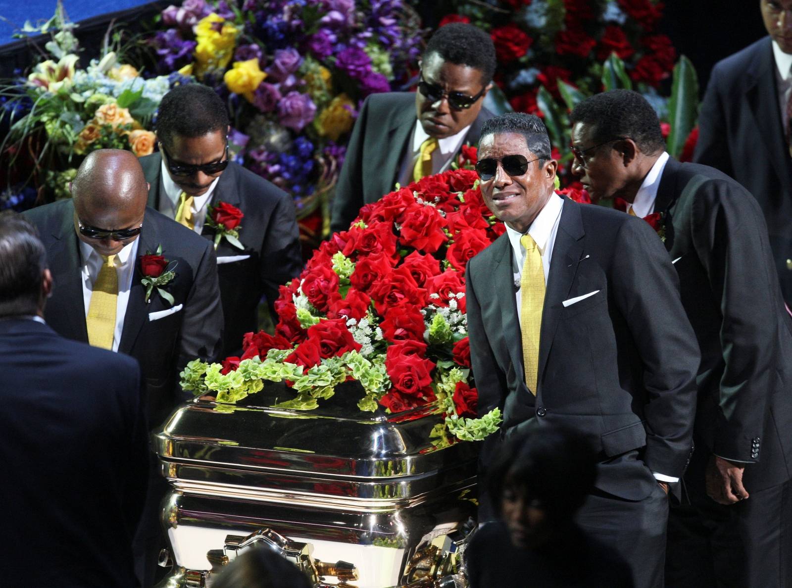 FILE PHOTO: Michael Jackson's brothers (L-R) Randy, Marlon, Tito, Jermaine, and Jackie carry his casket out of the Staples Center following memorial services for pop star Michael Jackson in Los Angeles