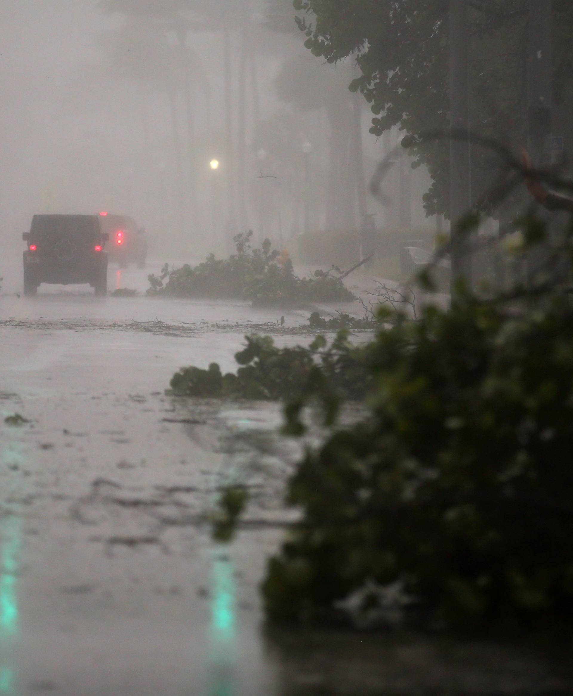 Vehicles drive along Ocean Drive in South Beach as Hurricane Irma arrives at south Florida, in Miami Beach, Florida