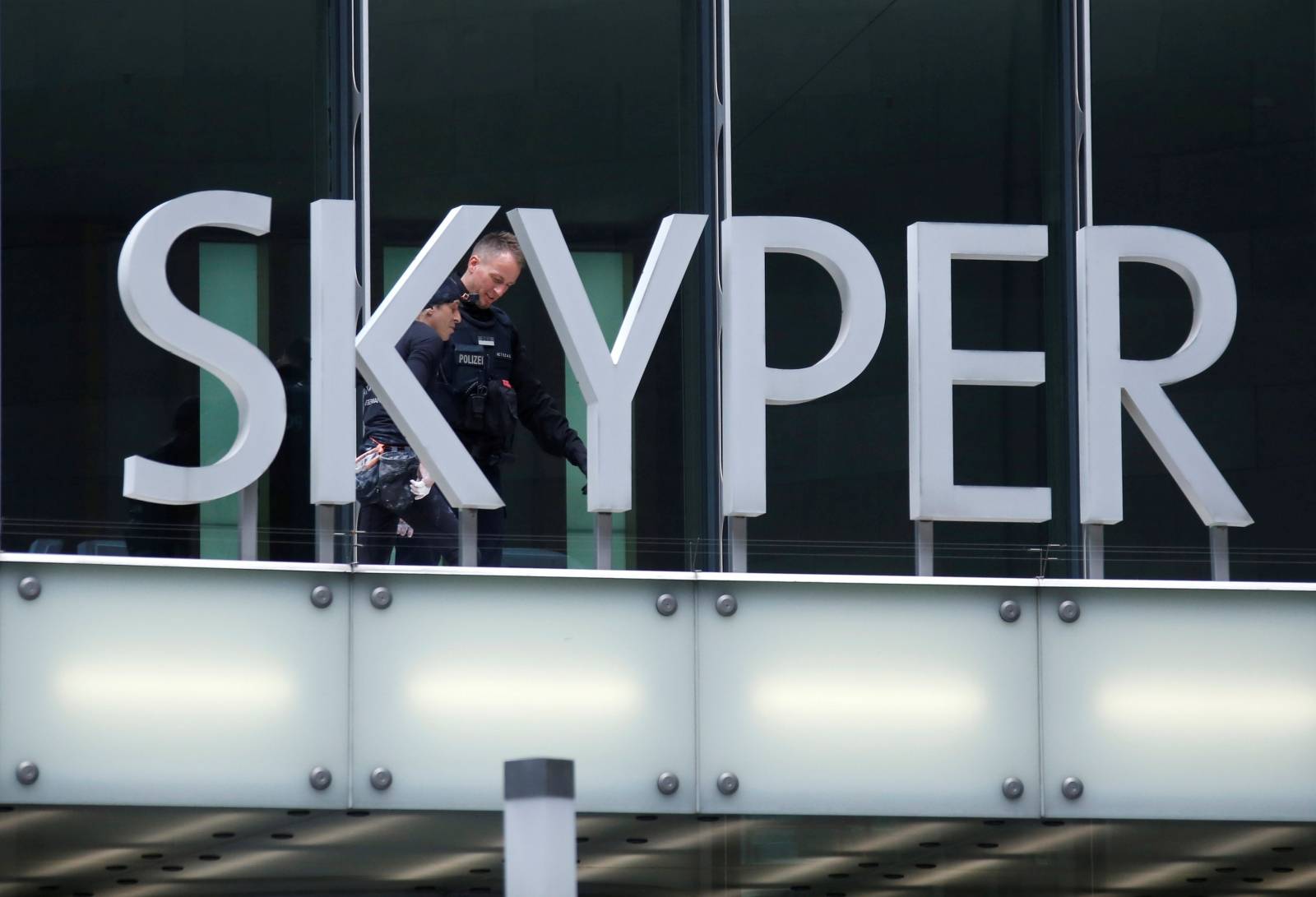 French urban climber Alain Robert climbs the Skyper building in Frankfurt