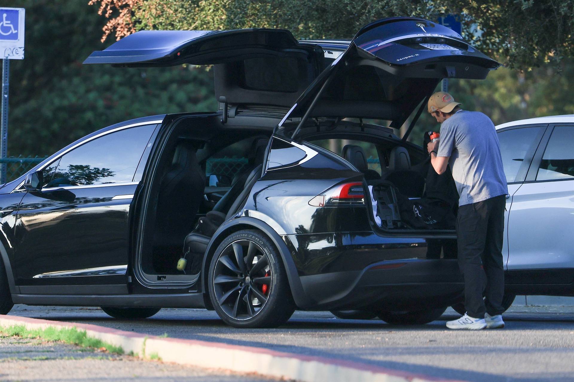 *EXCLUSIVE* Ashton Kutcher sports a mustache as he is seen taking his son to flag football, while Mila Kunis takes daughter to dance class in LA