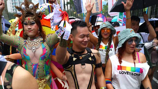 People dance during the annual pride parade in Taipei