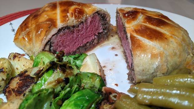 Gourmet Beef Wellington with Roasted Vegetables Eye-level View