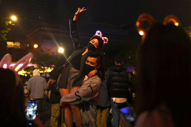 People gather near Taipei 101 skyscraper to celebrate the New Year in Taipei