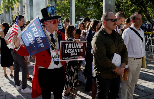 A supporter of former U.S. President Donald Trump stands outside The Wilkie D. Ferguson Jr. United States Courthouse, in Miami