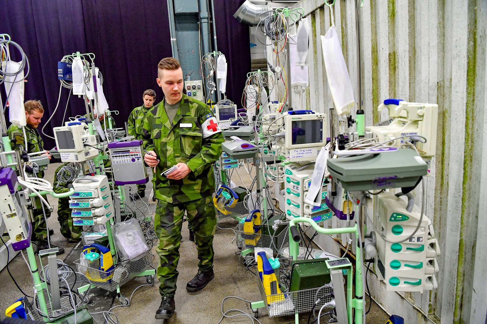 The Swedish Armed Forces build a field hospital inside the exhibition center Stockholmsmassan in Alvsjo