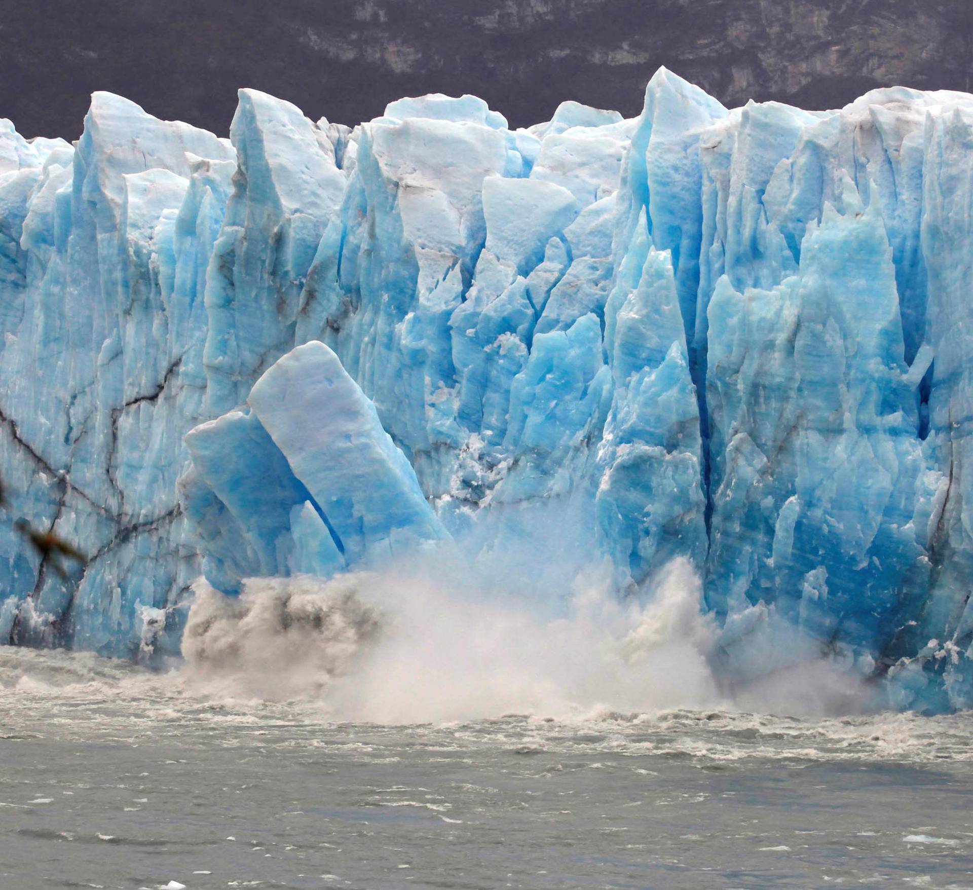 Pieces of ice fall from the front of Argentina's Perito Moreno glacier near the city of El Calafate