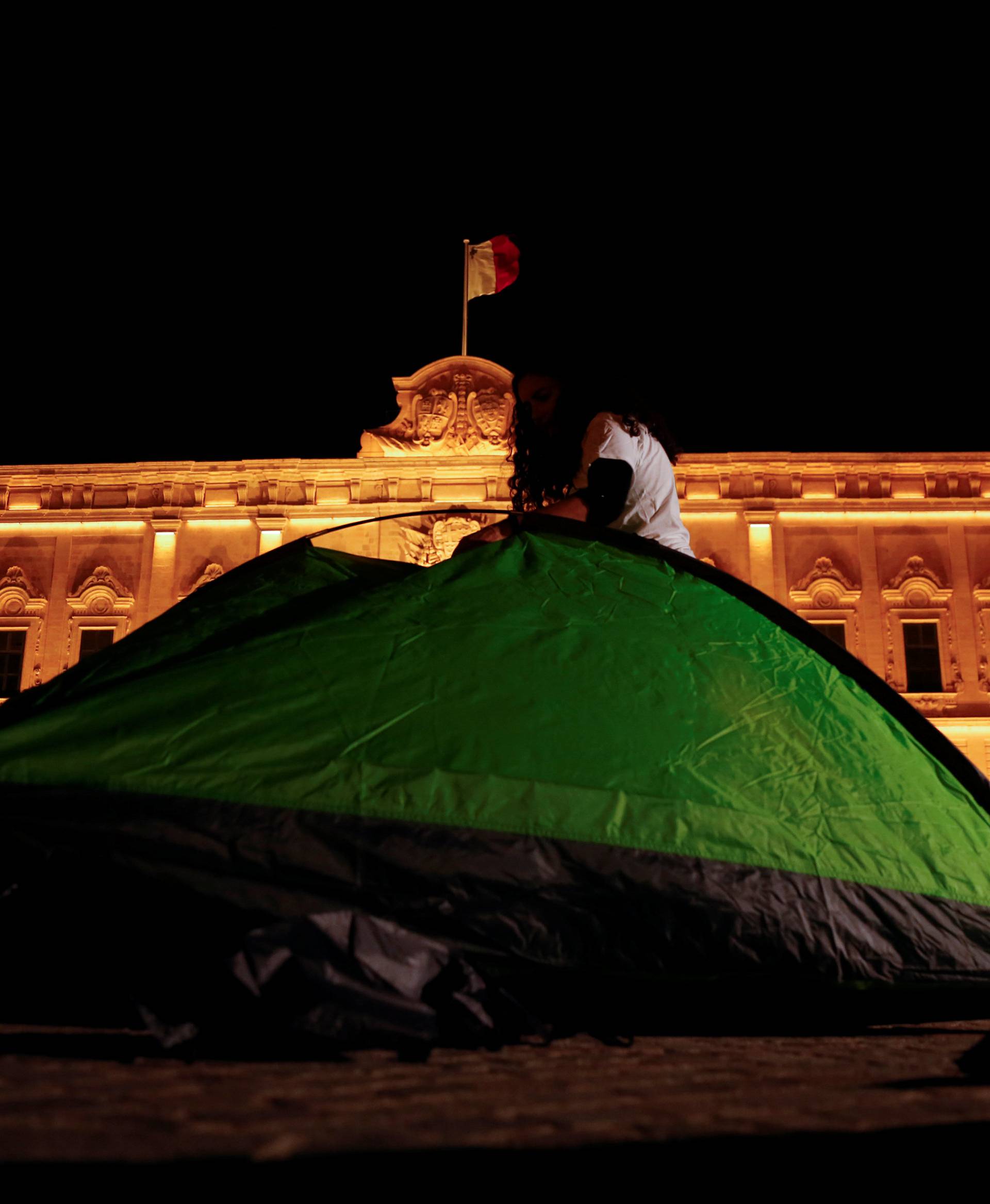 Protestors set up tents outside the Auberge de Castille at the start of a four-day protest against the assassination of investigative journalist Daphne Caruana Galizia, in Valletta