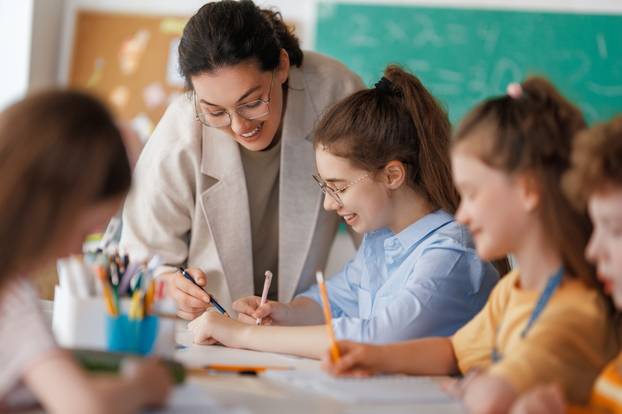 Happy,Kids,And,Teacher,At,School.,Woman,And,Children,Are