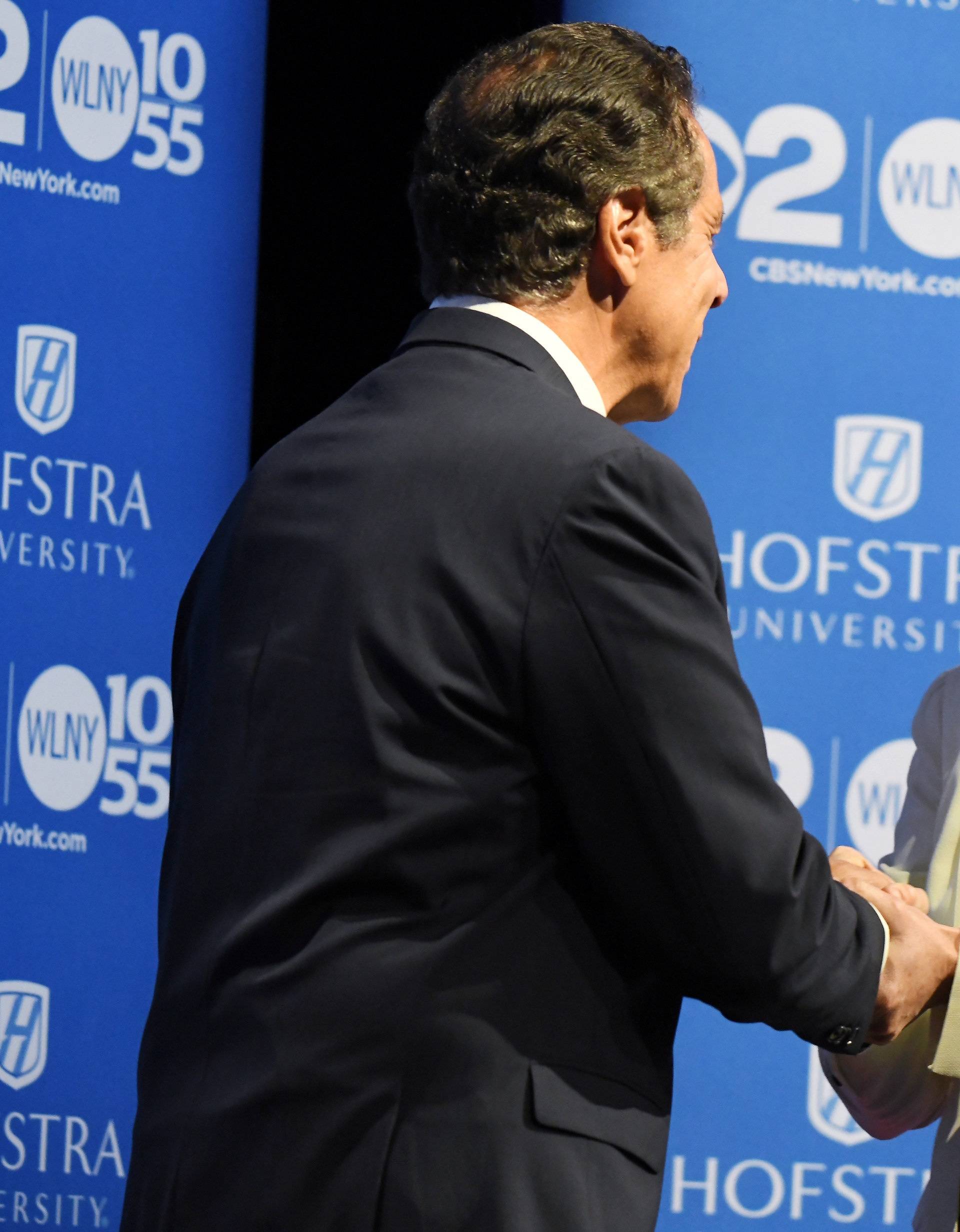 Governor Andrew M. Cuomo shakes hand with Cynthia Nixon prior to the Democratic gubernatorial primary debate at Hofstra University in Hempstead