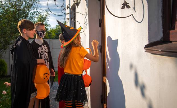 Children celebrate Halloween dressed up in costumes. Selective focus.