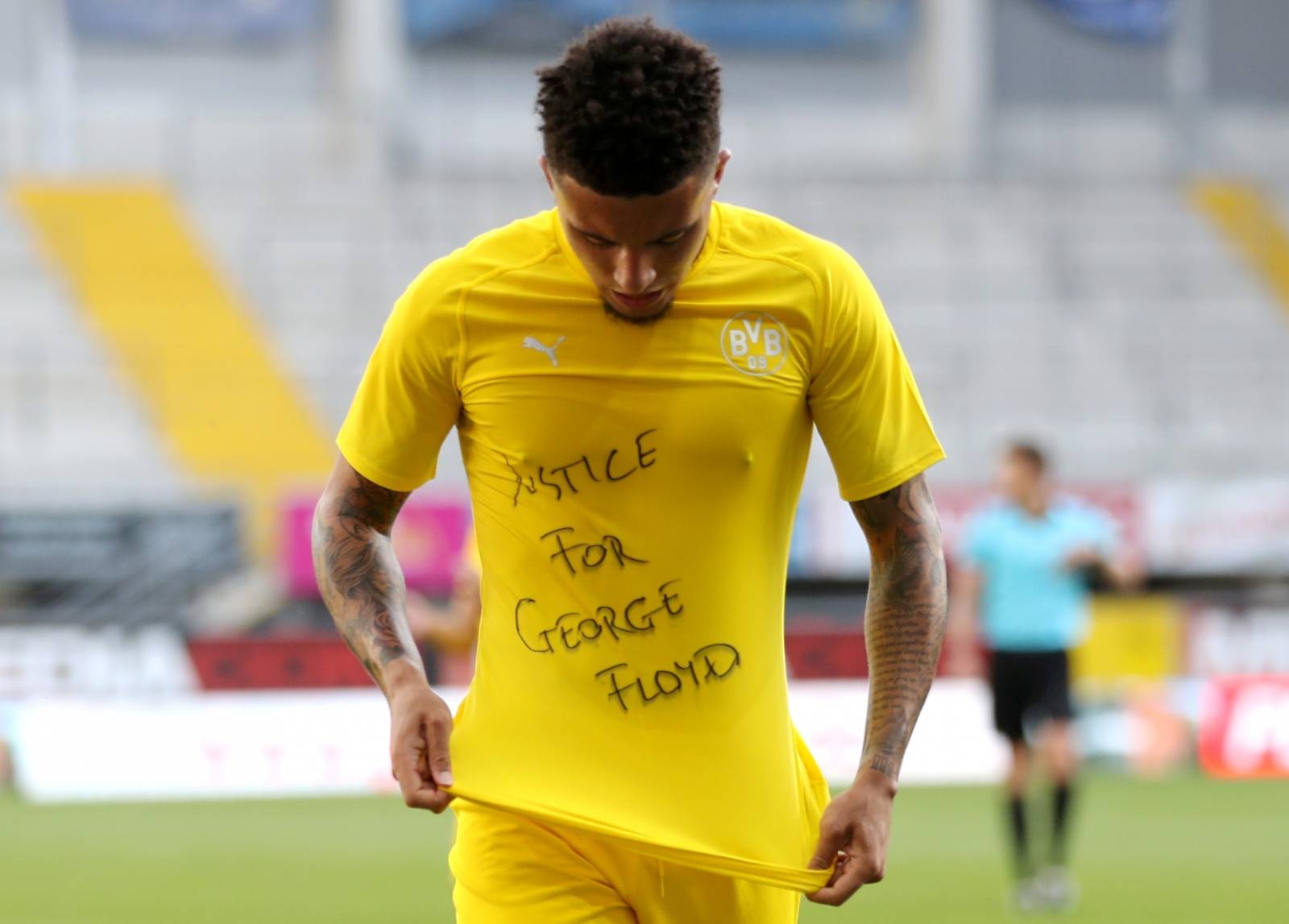 FILE PHOTO: Dortmund's Jadon Sancho celebrates scoring their second goal with a 'Justice for George Floyd' shirt, as play resumes behind closed doors following the outbreak of the coronavirus disease