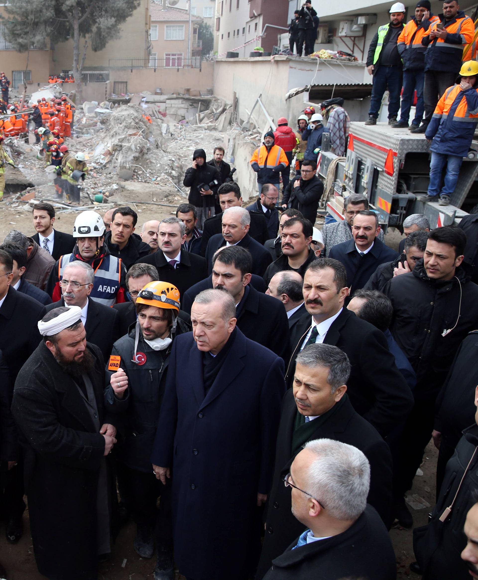 Turkish President Erdogan visits the site of a collapsed residential building in Istanbul