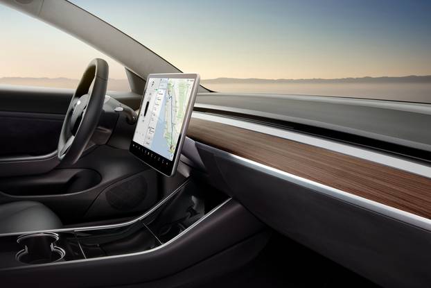 The interior of the Tesla Model 3 sedan is seen in this undated handout image as the car company handed over its first 30 Model 3 vehicles to employee buyers at the companyâs Fremont facility