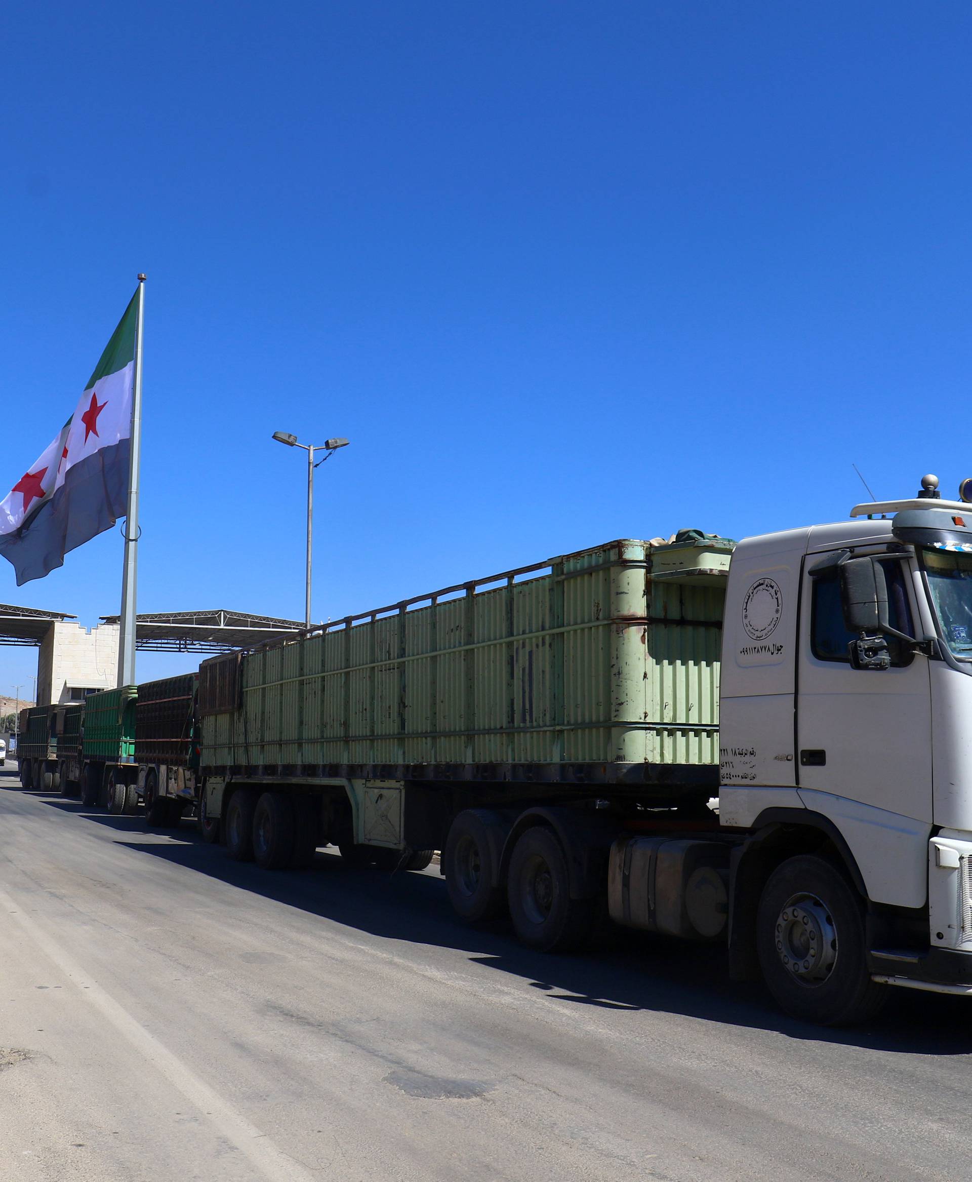 A Free Syrian Army flag flies at Bab al-Hawa crossing point in Syria