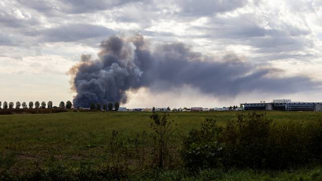 FILE PHOTO: Smoke billows from the fire at Drava International factory near Osijek
