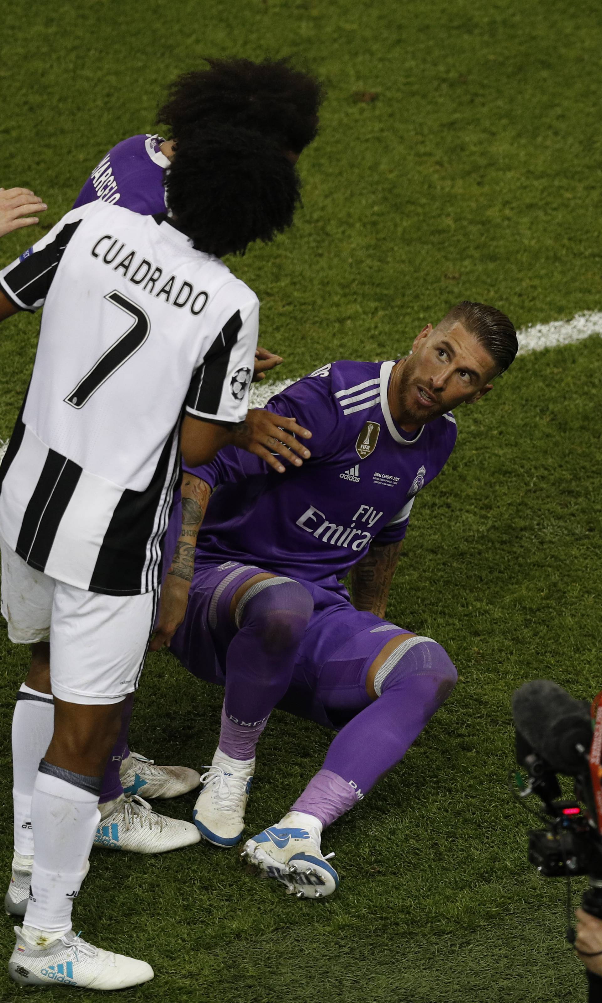 Juventus' Juan Cuadrado looks towards Real Madrid's Sergio Ramos before being sent off